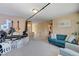 Bright living room space with neutral tones, comfortable seating, and ample natural light at 9413 Ironsend St, Las Vegas, NV 89143
