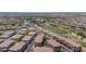 Beautiful aerial view of the neighborhood, showing the golf course and water feature at 1040 Via Panfilo Ave, Henderson, NV 89011
