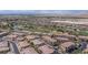 Aerial view of houses on a well designed community with a golf course at 1040 Via Panfilo Ave, Henderson, NV 89011