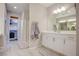 Bright bathroom featuring a double vanity, walk-in shower, and modern finishes throughout at 1040 Via Panfilo Ave, Henderson, NV 89011