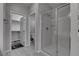 Bathroom with walk-in shower and entry to walk-in closet and toilet at 1040 Via Panfilo Ave, Henderson, NV 89011