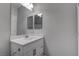 Bathroom featuring a white vanity and large mirror, providing a bright and practical space at 1040 Via Panfilo Ave, Henderson, NV 89011