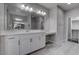 Well-lit bathroom featuring dual sinks, ample countertop space, and modern fixtures at 1040 Via Panfilo Ave, Henderson, NV 89011