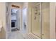 Bathroom with a glass shower, linen closet, and modern finishes for a spa-like feel at 1040 Via Panfilo Ave, Henderson, NV 89011