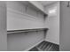 Walk-in closet featuring ample shelving and neutral color palette at 1040 Via Panfilo Ave, Henderson, NV 89011