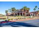 Beautiful community clubhouse surrounded by lush landscaping and palm trees at 1040 Via Panfilo Ave, Henderson, NV 89011