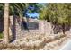 Elegant stone entrance sign for the Fiori community, surrounded by mature trees at 1040 Via Panfilo Ave, Henderson, NV 89011