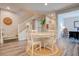 Bright dining area with a round table and staircase access offers a welcoming space for meals and gatherings at 1040 Via Panfilo Ave, Henderson, NV 89011