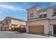 Well-maintained townhome featuring a private garage and a beautifully landscaped exterior at 1040 Via Panfilo Ave, Henderson, NV 89011