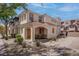 Charming townhome with stucco exterior, covered porch, and manicured landscaping in a desirable community at 1040 Via Panfilo Ave, Henderson, NV 89011
