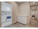 Hallway area leading to laundry and bedroom, with built-in storage cabinets at 1040 Via Panfilo Ave, Henderson, NV 89011