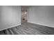 Hallway with wood plank flooring looking onto staircase and adjacent room at 1040 Via Panfilo Ave, Henderson, NV 89011