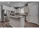 Kitchen with stainless steel appliances, granite countertops, and white cabinets at 1040 Via Panfilo Ave, Henderson, NV 89011