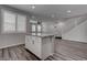 Kitchen island features granite countertops and stainless steel appliances, and is lit by recessed lighting at 1040 Via Panfilo Ave, Henderson, NV 89011