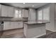 Bright kitchen features granite countertops, white cabinets, and stainless steel appliances at 1040 Via Panfilo Ave, Henderson, NV 89011