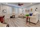 Stylish living room boasts wood-look floors, natural light, and neutral color palette with comfortable seating at 1040 Via Panfilo Ave, Henderson, NV 89011