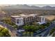 Beautiful aerial view of this modern complex surrounded by greenery and mountains in the background at 11441 Allerton Park Dr # 217, Las Vegas, NV 89135