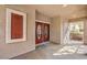 The front porch has double doors, shutters, and outside seating at 1332 Cedar Berry Ct, Henderson, NV 89012