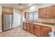 Kitchen boasting stainless steel appliances, wood cabinets, and granite countertops at 1332 Cedar Berry Ct, Henderson, NV 89012