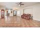 Open-concept living room featuring tile flooring, neutral paint, and ample natural light at 1332 Cedar Berry Ct, Henderson, NV 89012