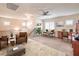 Loft area with carpet, desk and chair, comfortable seating, and large windows at 1332 Cedar Berry Ct, Henderson, NV 89012