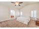 Spacious main bedroom featuring a ceiling fan, and a private ensuite bathroom at 1332 Cedar Berry Ct, Henderson, NV 89012