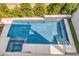 Aerial view of the luxurious pool with a spa and beautifully landscaped backyard at 1332 Cedar Berry Ct, Henderson, NV 89012