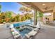 Beautiful backyard with a sparkling pool, spa, and lounge chairs at 1332 Cedar Berry Ct, Henderson, NV 89012