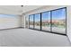 A bright bedroom featuring walls of sliding glass with access to views of the lake at 14 Heron Harbour Dr, Henderson, NV 89011