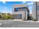 Modern exterior with a stucco siding and a two-car garage at 14 Heron Harbour Dr, Henderson, NV 89011