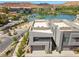 Modern exterior with a lake view featuring stucco siding and a two-car garage at 14 Heron Harbour Dr, Henderson, NV 89011