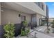 Inviting front entrance with modern landscaping, featuring desert plants and a sleek pathway, enhancing curb appeal at 14 Heron Harbour Dr, Henderson, NV 89011