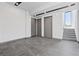 Bright living room with tile flooring, recessed lighting, and multiple doors at 14 Heron Harbour Dr, Henderson, NV 89011