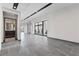 Open-concept living room featuring modern lighting, tile flooring, and large windows showcasing a view at 14 Heron Harbour Dr, Henderson, NV 89011