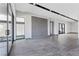 Bright living room featuring tile flooring, recessed lighting, and large glass doors to the outside at 14 Heron Harbour Dr, Henderson, NV 89011