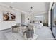 Staged main bedroom with modern decor, contemporary lighting, and neutral color palette at 14 Heron Harbour Dr, Henderson, NV 89011