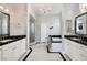 Bright bathroom featuring dual sinks, bathtub, large mirror and a glass door shower at 1404 Colony Pine St, Las Vegas, NV 89144