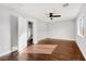 Bedroom featuring hard wood floors, a ceiling fan, and a large window at 1404 Colony Pine St, Las Vegas, NV 89144