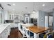 Bright kitchen with a large island, white cabinets, stainless steel appliances and adjacent dining space at 1404 Colony Pine St, Las Vegas, NV 89144