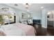 Sunlit main bedroom featuring a large window and hardwood floors at 1404 Colony Pine St, Las Vegas, NV 89144