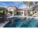 Backyard pool with palm trees and beautiful desert landscaping at 1404 Colony Pine St, Las Vegas, NV 89144