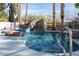 Desert home backyard pool featuring a rock waterfall at 1404 Colony Pine St, Las Vegas, NV 89144