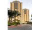 Exterior of a high rise featuring well-manicured landscaping and elegant architecture at 145 E Harmon Ave # 2008, Las Vegas, NV 89109