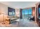 Inviting living room with comfortable seating and expansive city view windows at 145 E Harmon Ave # 2008, Las Vegas, NV 89109