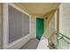 A welcoming entrance features a vibrant green door and a secure screen window at 1509 Linnbaker Ln # 203, Las Vegas, NV 89110