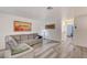 Relaxing living room featuring gray-wash floors, gray sectional, with great natural light at 1509 Linnbaker Ln # 203, Las Vegas, NV 89110