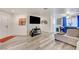 Bright, open-concept living area with gray-wash floors and ample space at 1509 Linnbaker Ln # 203, Las Vegas, NV 89110