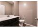 Bathroom with a vanity, modern sink, and toilet at 1544 Karst Pond Ave, North Las Vegas, NV 89084