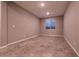 Bedroom featuring tile floors, neutral paint, and a window at 1544 Karst Pond Ave, North Las Vegas, NV 89084