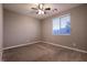 Bedroom with large window and ceiling fan providing comfort and light at 1544 Karst Pond Ave, North Las Vegas, NV 89084